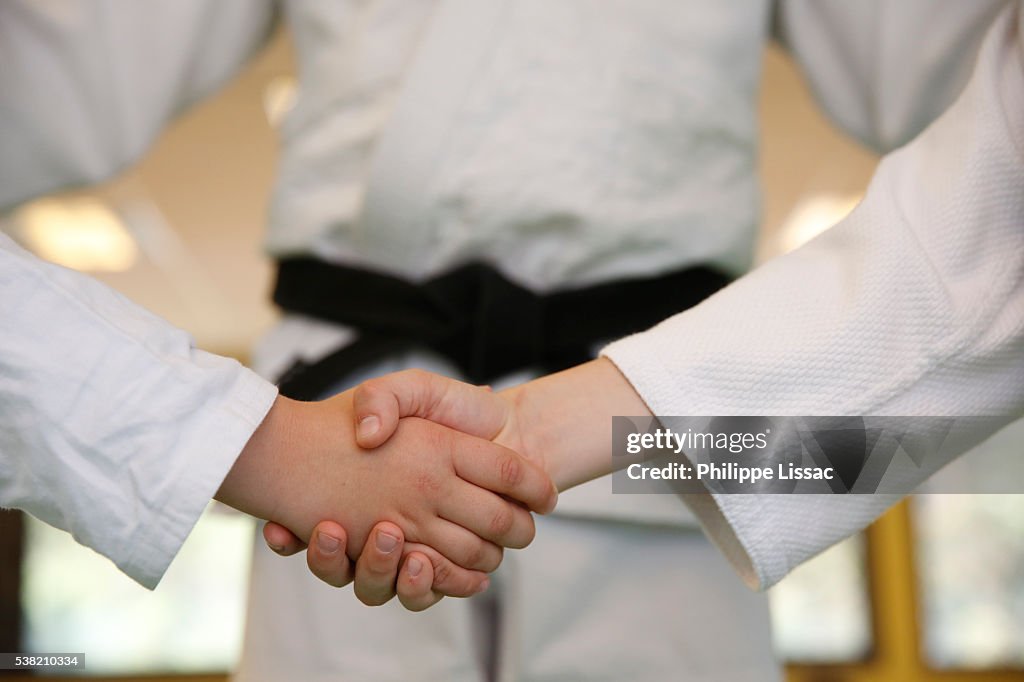 Judokas shaking hands