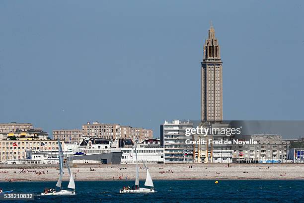 beach and city of le havre. saint-joseph's church. - le havre stock pictures, royalty-free photos & images