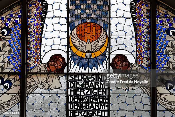 am steinhof church (leopold's church). stained glass by koloman moser. holy spirit. - stained glass angel stock pictures, royalty-free photos & images