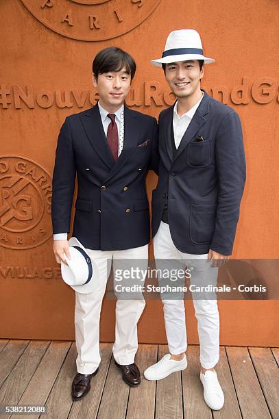 South Korean international football player, Kim Ji-Sung and South Korean actor Lee Jin-Wook attends day Fourteen of the 2016 French Open at Roland...