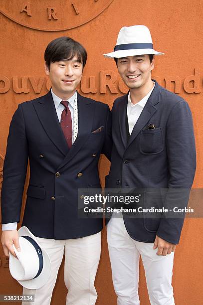 South Korean international football player, Kim Ji-Sung and South Korean actor Lee Jin-Wook attends day Fourteen of the 2016 French Open at Roland...