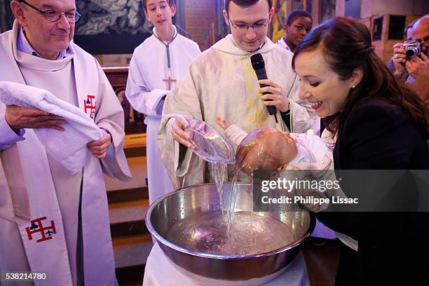 baptism in saint-jacques's church - godmother stock pictures, royalty-free photos & images