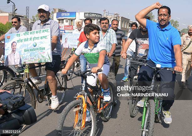Anil Joshi , Punjab state minister for local bodies, medical education and research, rides in a cycle rally along with volunteers on World...