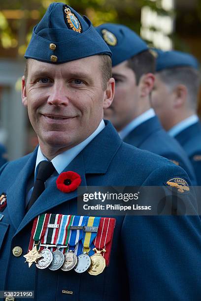 poppy parade in ypres on armistice day - menin gate stock pictures, royalty-free photos & images