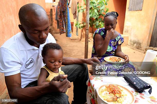 family meal. - lome stock pictures, royalty-free photos & images