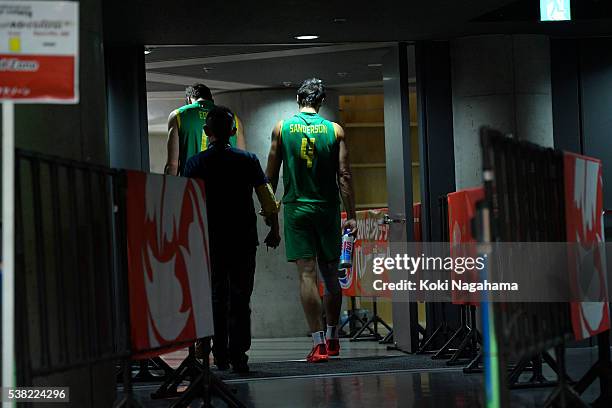 Dejected Thomas Edgar and Paul Sanderson of Australia leave a court after losing the Men's World Olympic Qualification game between Australia and...