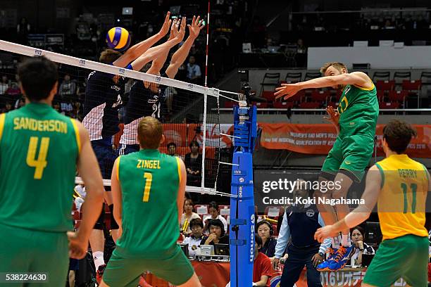 Paul Carroll of Australia spikes the ball during the Men's World Olympic Qualification game between Australia and Poland at Tokyo Metropolitan...