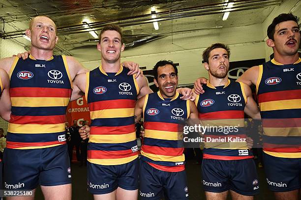 Sam Jacobs, Josh Jenkins, Eddie Betts and Taylor Walker of the Crows sing the club song after the round 11 AFL match between the Adelaide Crows and...