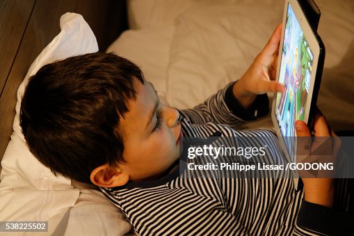 8-year-old boy using an tablet computer 8-year-old boy using an tablet computer