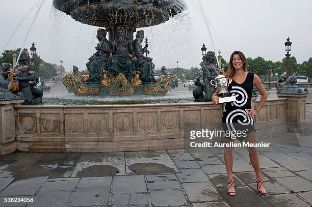 Garbine Muguruza of Spain poses with La Coupe Suzanne Lenglen after winning the women's final at the French Open at Place de la Concorde on June 5,...