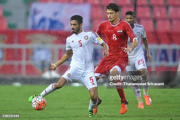 Fawaz Almessabi of United Arab Emirates and Fadi Saleh of Jordan competes for the ball during the 44th King's Cup match between the United Arab...