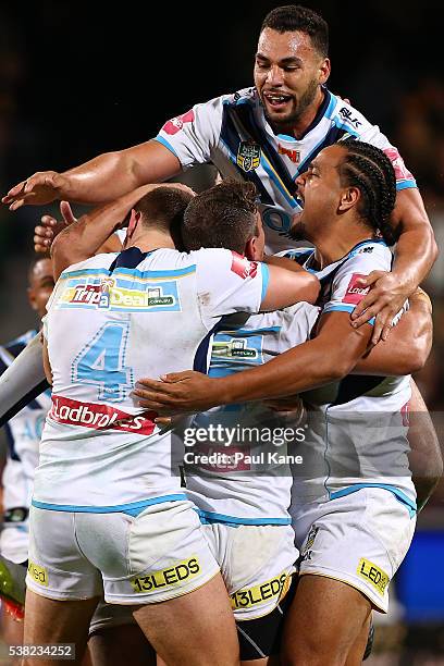 The Titans celebrate after a field goal by Ashley Taylor in double extra time to win the round 13 NRL match between the South Sydney Rabbitohs and...