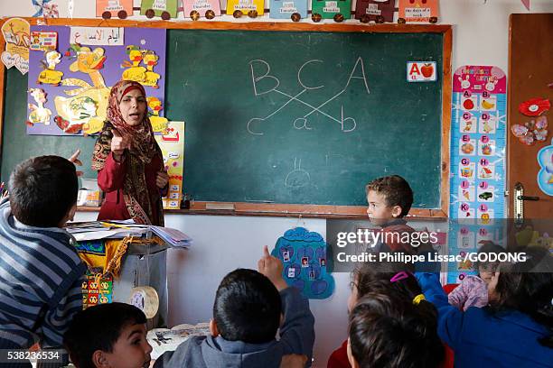 primary school in beit scaria, west bank. - palestinian boy stock pictures, royalty-free photos & images