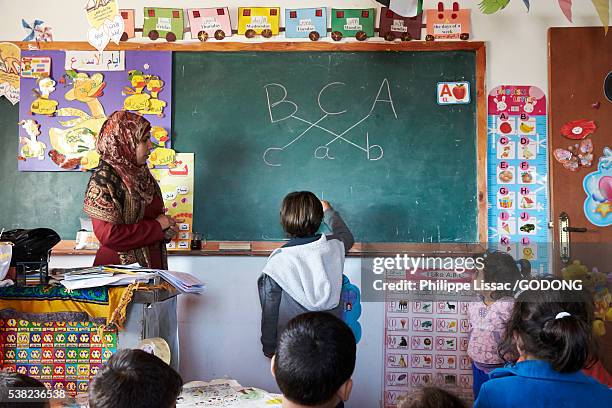 primary school in beit scaria, west bank. - palestinian boy stock pictures, royalty-free photos & images