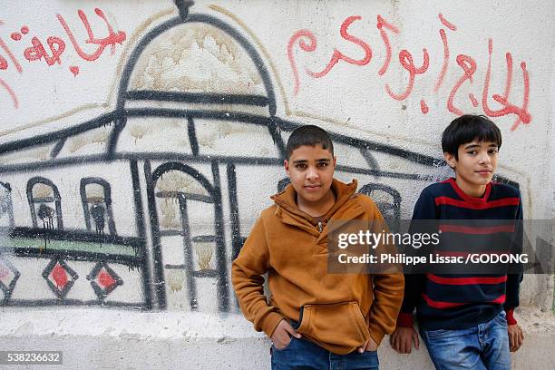 palestinian boys in amari refugee camp, al bireh, west bank, palestine. - amaari refugee camp stock pictures, royalty-free photos & images