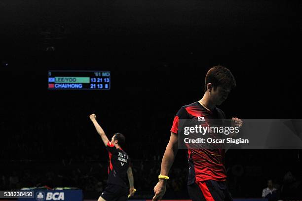 Lee Yong Dae and Yoo Yeon Seong of South Korea celebrate after a point during the 2016 Indonesia Open final match in man double against Chai Biao and...
