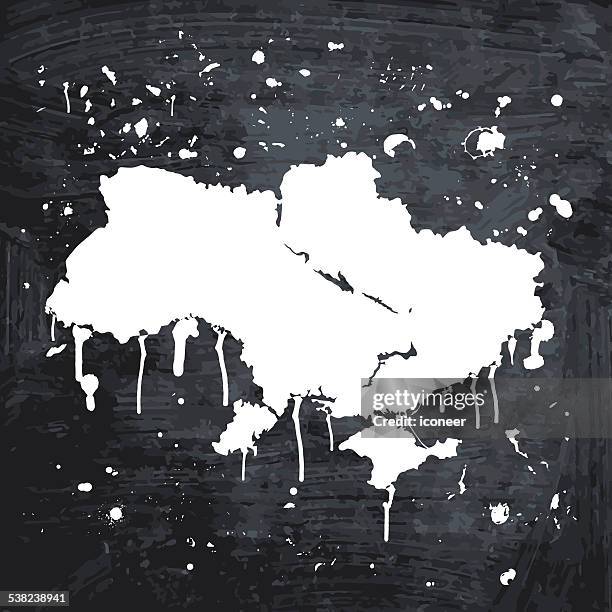 ukraine map graffiti white splats on black wall - polished concrete stock illustrations