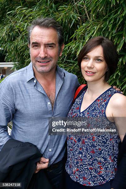 Actor Jean Dujardin and Nathalie Pechalat attend Day Fifteen, Men single's Final of the 2016 French Tennis Open at Roland Garros on June 5, 2016 in...