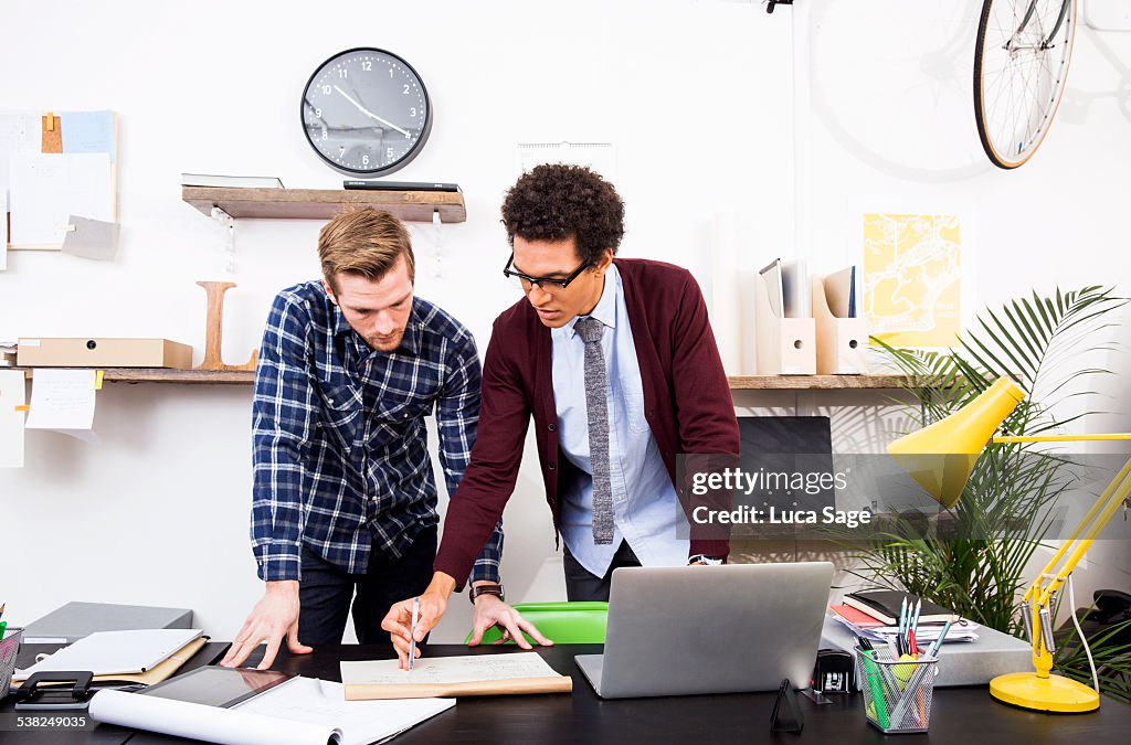 Two young creatives evaluating a design project