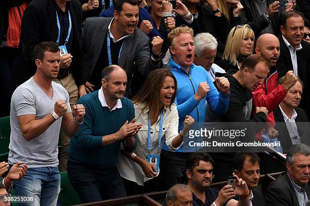 Leon Smith, William Murray , Kim Sears , Mark Bender , Matt Little and Jamie Delgado applaud Andy Murray of Great Britain as he wins the first set...