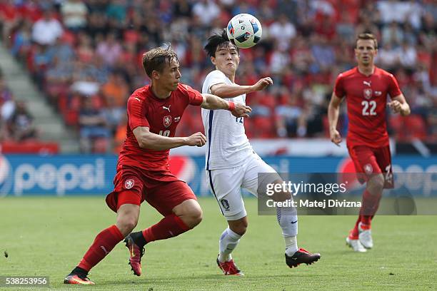 Josef Sural of Czech Republic competes for the ball with Ju Sejong of Korea during an international friendly match between Czech Republic and Korea...