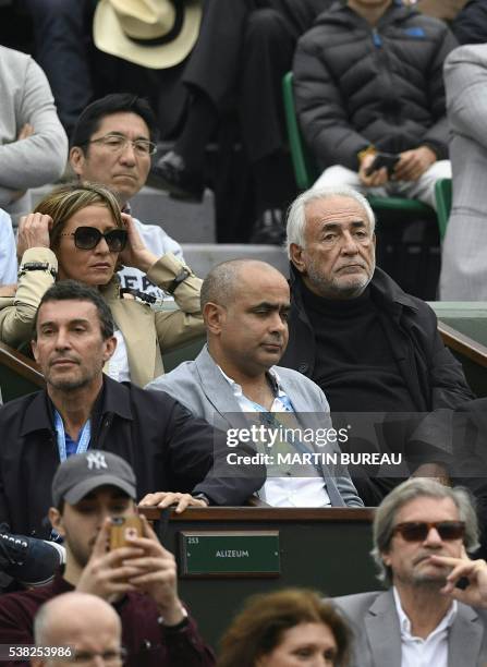 Former French Economy Minister Dominique Strauss-Kahn and his partner Myriam L'Aouffir attend the men's final match between Britain's Andy Murray and...