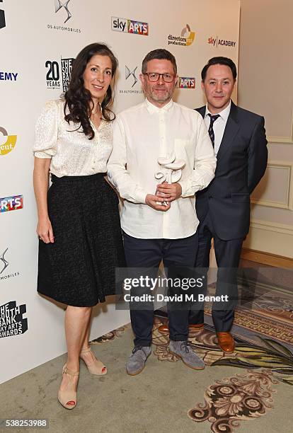 Set designer Anna Fleischle, director Matthew Dunster and cast member Reece Shearsmith, accepting the Theatre award on behalf of "Hangmen", pose in...