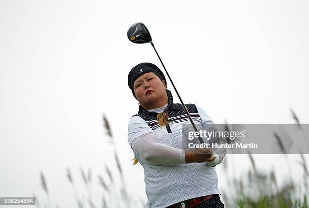Christina Kim hits her tee shot on the third hole during the final round of the ShopRite LPGA Classic presented by Acer on the Bay Course at the...