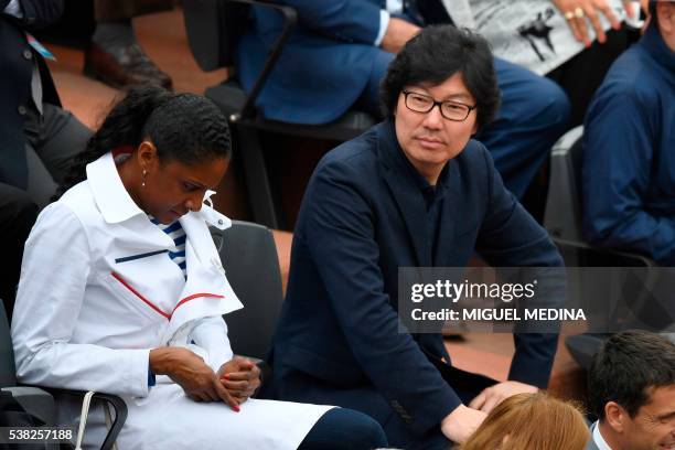 Former French athlete Marie-Jose Perec and French State Reform minister Jean-Vincent Place attend the men's final match between Britain's Andy Murray...