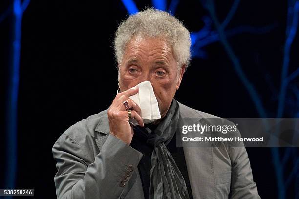 Sir Tom Jones appears to fight back tears during the 2016 Hay Festival on June 5, 2016 in Hay-on-Wye, Wales. This is the Welsh singer's first public...