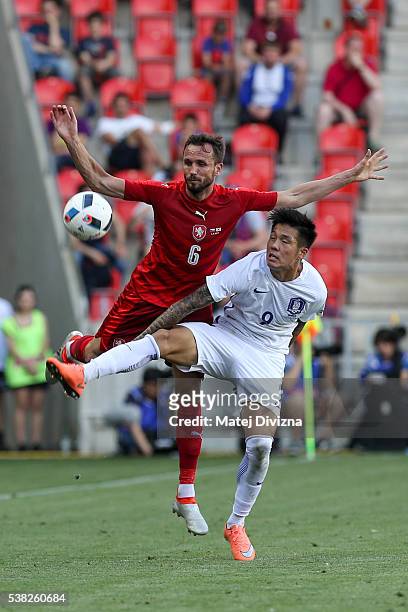 Toma Sivok of Czech Republic competes for the ball with Suk Hyunjun of Korea during an international friendly match between Czech Republic and Korea...