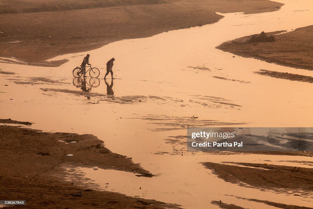 People crossing Kangsabati River on foot,winter