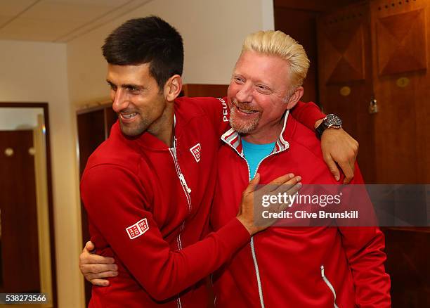 Champion Novak Djokovic of Serbia clebrates with his coach, Boris Becker following his victory during the Men's Singles final match against Andy...