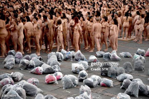 More than 6,000 Colombians pose in the nude for American art photographer Spencer Tunick at Bolivar Square in Bogota, on June 5, 2016. - Tunick,...