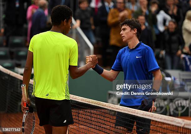 Geoffrey Blancaneaux of France shakeshands with Felix Auger Aliassime of Canada following his victory during the Boys Singles final match on day...