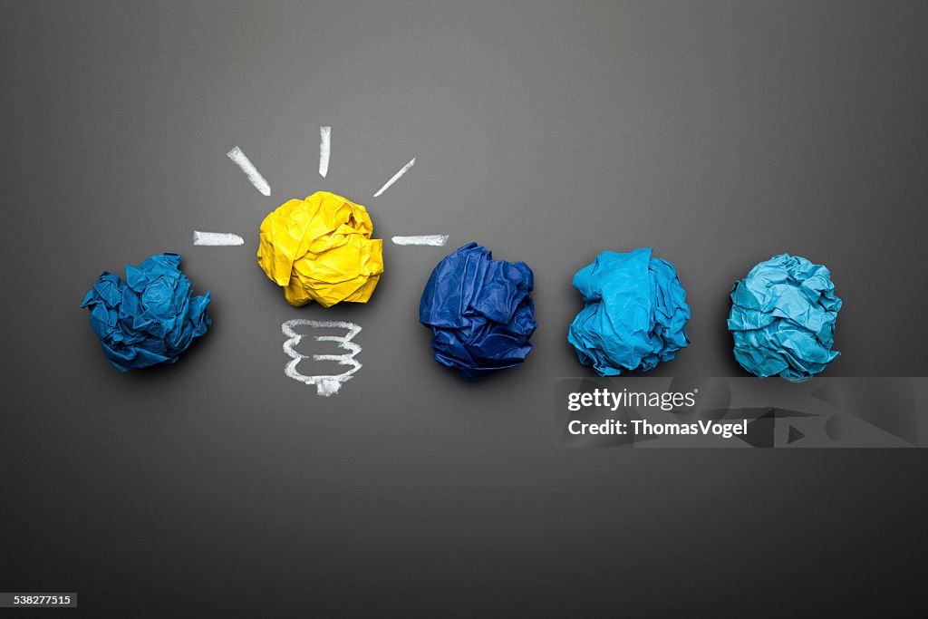 Light bulb crumpled paper on blackboard - Idea Concept Background