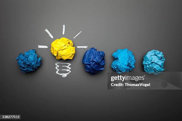 light bulb crumpled paper on blackboard - idea concept background - frustration concept stock pictures, royalty-free photos & images