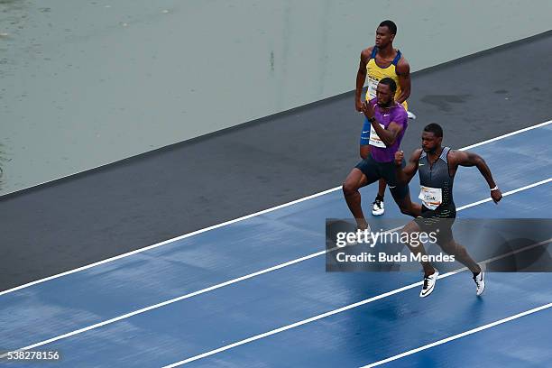 Justin Gatlin of the United States , runs against Richard Thompson of Trinidad and Tobago and Vitor Hugo Santos of Brazil during the "Mano a Mano"...