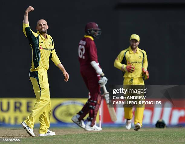 Australia's Nathan Lyon catches out the West indie's Sulieman Benn during a One-day International cricket match between the West Indies and Australia...