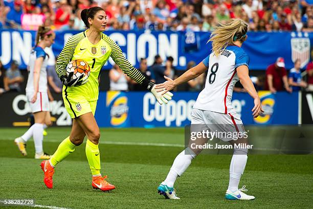 Goal keeper Hope Solo celebrates with Julie Johnston of U.S. Women's National Team during the second half of a friendly match against Japan on June...