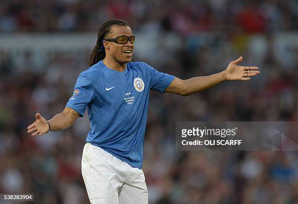 Former Dutch footballer Edgar Davids gestures during the Soccer Aid charity football match between England and the Rest of the World at Old Trafford...