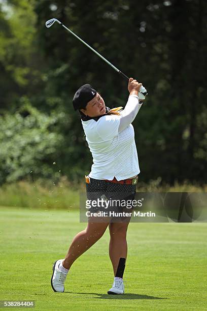 Christina Kim hits her second shot on the 13th hole during the final round of the ShopRite LPGA Classic presented by Acer on the Bay Course at the...
