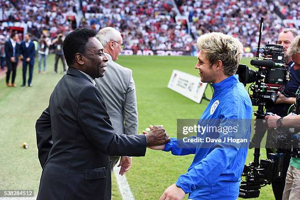 Niall Horan greets Pele during Soccer Aid at Old Trafford on June 5, 2016 in Manchester, England.