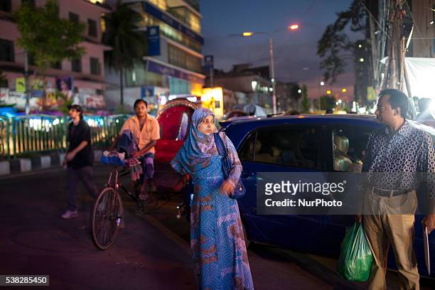 Bangladeshi women wait for bus to go home at evening in Dhaka, Bangladesh on June 05, 2016. The wife of a top anti-terror police officer was murdered...