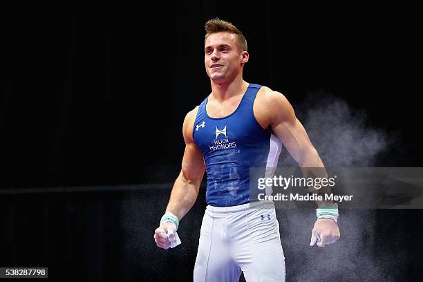 Sam Mikulak reacts after competing on the still rings during the 2016 Men's P&G Gymnastics Championships at the XL Center on June 5, 2016 in...