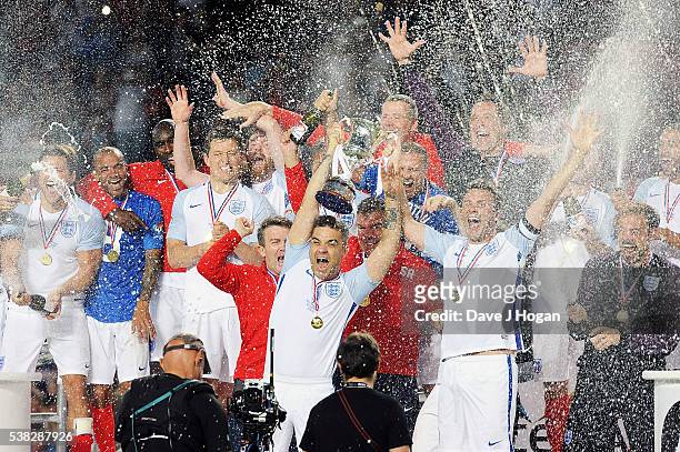Team England celebrates after winning Soccer Aid at Old Trafford on June 5, 2016 in Manchester, England.
