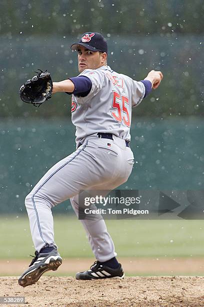 538289 Danys Baez, of the Cleveland Indians delivers a pitch during a snow ...