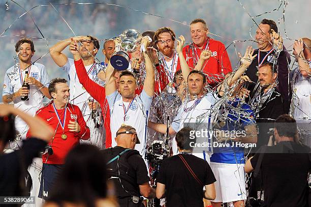 Team England celebrates after winning Soccer Aid at Old Trafford on June 5, 2016 in Manchester, England.