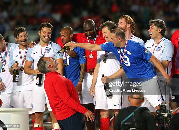 Paddy McGuinness of England pours champagne over Sam Allardyce after the Soccer Aid 2016 match in aid of UNICEF at Old Trafford on June 5, 2016 in...