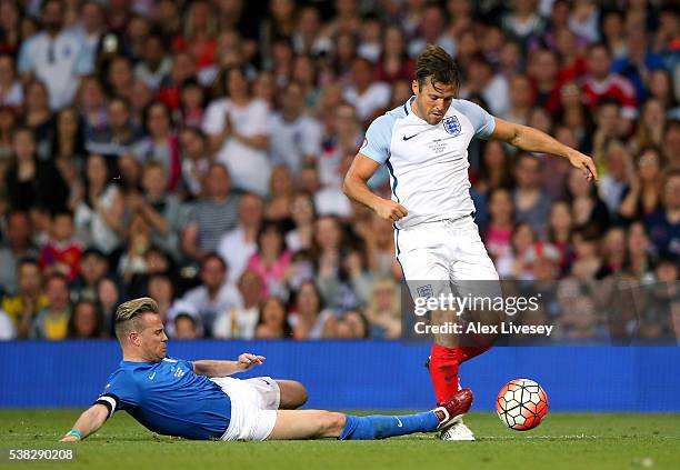 Mark Wright of England beats Nicky Byrne of Rest of the World during the Soccer Aid 2016 match in aid of UNICEF at Old Trafford on June 5, 2016 in...